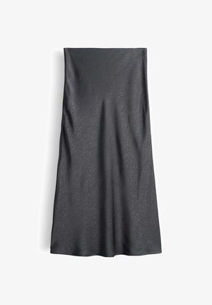Gonna nera in tessuto testurizzato con un sottile motivo a foglia. Ha un design dritto, lunghezza fino al pavimento, con un drappeggio morbido e senza qualsiasi abbellimento visibile.