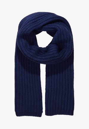 Donkerblauwe gebreide sjaal met dikke textuur en geribd patroon, opgevouwen in een lus waarbij beide uiteinden naar beneden hangen.
