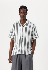 Short-sleeve shirt in light fabric, featuring blue and white vertical stripes, a buttoned front, and a relaxed collar design.
