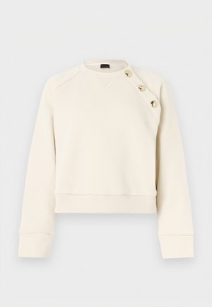 Cream sweatshirt with a round neck, ribbed hem, and cuffs. Features gold buttons on the left shoulder and a smooth texture.