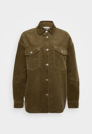 Kakija korduroja krekls-jaka ar apkakli, sudraba pogām un divām krūšu kabatām. Iezīmē relaksētu piegriezumu un ribotu struktūru.