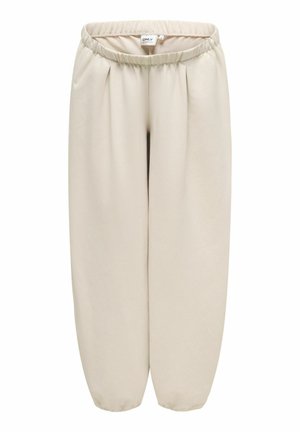 Pantalon de maternité beige à coupe ample avec taille élastique et poignets élastiques, conçu pour le confort et la flexibilité.