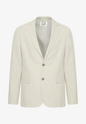 Svetlo bež laneni sako z izrezanim poklopcem, zapiranjem na dva gumba in sprednjimi žepi. Ima subtilno teksturo in enostavno notranjost.