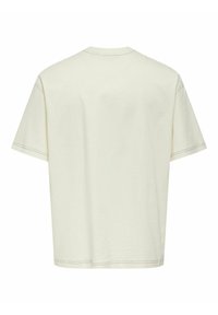 Kortærmet, kremfarvet t-shirt lavet af blød bomuld. Har en afslappet pasform, minimal syningdetaljer og et klassisk crew neck-design.