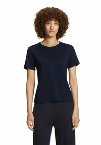 T-shirt corto blu scuro realizzato in un tessuto liscio. Presenta un colletto rotondo e una vestibilità rilassata, senza motivi o dettagli visibili.
