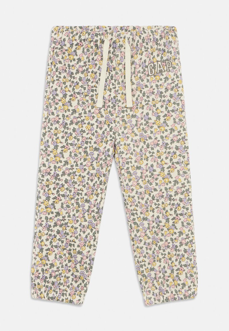 Pantalones de chándal con estampado floral en crema y flores de colores variados. Cuentan con una cintura elástica con cordón y puños acanalados, logo de la marca en un lateral.