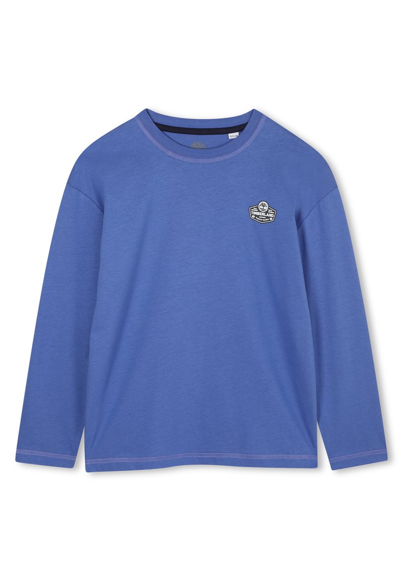 Langarmige blauwe katoenen shirt met een ronde hals en een Timberland-logo patch op de borst. Gladde textuur met ingezette mouwen.