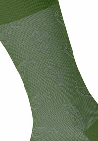 Zielone wełniane skarpetki z teksturowanym wzorem i subtelnymi akcentami w jasnym odcieniu zieleni, tworzącymi faliste kształty.