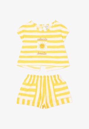 Completo per bambini con righe gialle e bianche, maniche corte e pantaloncini, con un sole sorridente e la scritta "solecito bonito" sulla maglietta.