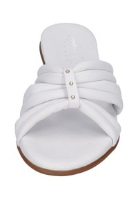 White slide sandal with pleated design and a central strap featuring three metallic studs. Soft leather texture and a flat brown sole.