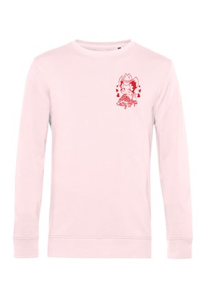Jasnoróżowa koszula z długim rękawem z małą czerwoną Betty Boop w kapeluszu kowbojskim otoczoną sercami na lewej piersi.