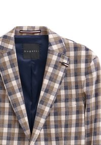 Kariertes Blazer in Creme, Braun und Marineblau. Mit Schalkragen, einer Innentasche und einem Markenetikett auf der Innenseite. Strukturierten Stoff.