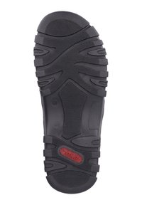 Semelle de chaussure en caoutchouc noir avec un motif de texture et des profondeurs marquées. Présente un logo "rieker" rouge prominent près du talon. Taille 41 indiquée.