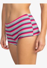 Multicolored striped swim shorts featuring pink, blue, and black hues. Made from textured fabric with a snug fit and a flat waistband.