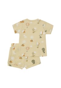 Kortärmad, ribbad pyjamasset i ljusgul med ett mönster av dinosaurier och luftballonger, med matchande shorts. Mjuk bomullsmaterial.