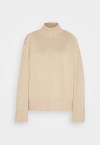 Pull à col roulé beige avec un motif tricoté texturé, des poignets et un ourlet côtelés. Présente une coupe décontractée et un design minimaliste.