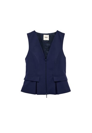 Veste sans manches bleu marine avec fermeture éclair à l'avant, coutures ajustées et poches à rabat sur fond blanc.