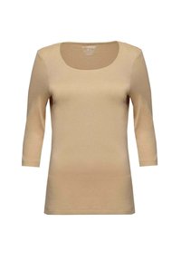 Beige Langarmoberteil mit rundem Ausschnitt. Hergestellt aus weichem, dehnbarem Stoff mit glatter Oberfläche und tailliertem Schnitt.