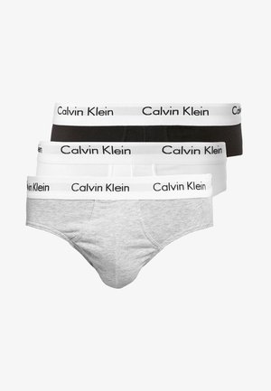 Trīs vīriešu apakšveļas komplekti pelēkā, melnā un baltā krāsā, katrs ar kontrastējošu Calvin Klein logotipa jostu. Mīkstas kokvilnas audums, klasiskā forma.