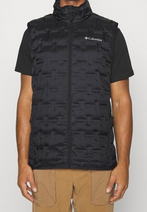Gilet imbottito nero con colletto alto, cerniera frontale e logo Columbia sul petto a sinistra. Presenta un motivo trapuntato orizzontale e tasche laterali.