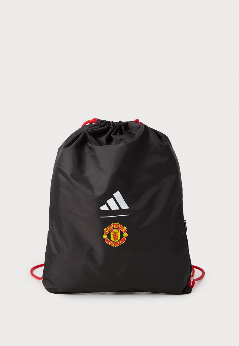 Fekete húzózsinóros táska, nylontból készült, piros zsinórokkal, Adidas logóval és Manchester United emblémával az elején. Simított felület, téglalap alakú.