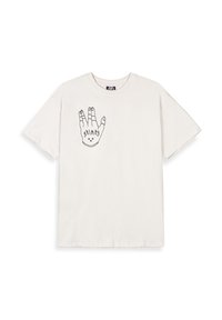 Camiseta de algodón color crema con un gráfico de contorno negro de una mano con elementos de diseño. Mangas cortas y estilo de cuello redondo.