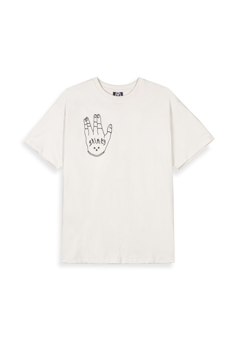 Camiseta de algodón color crema con un gráfico de contorno negro de una mano con elementos de diseño. Mangas cortas y estilo de cuello redondo.
