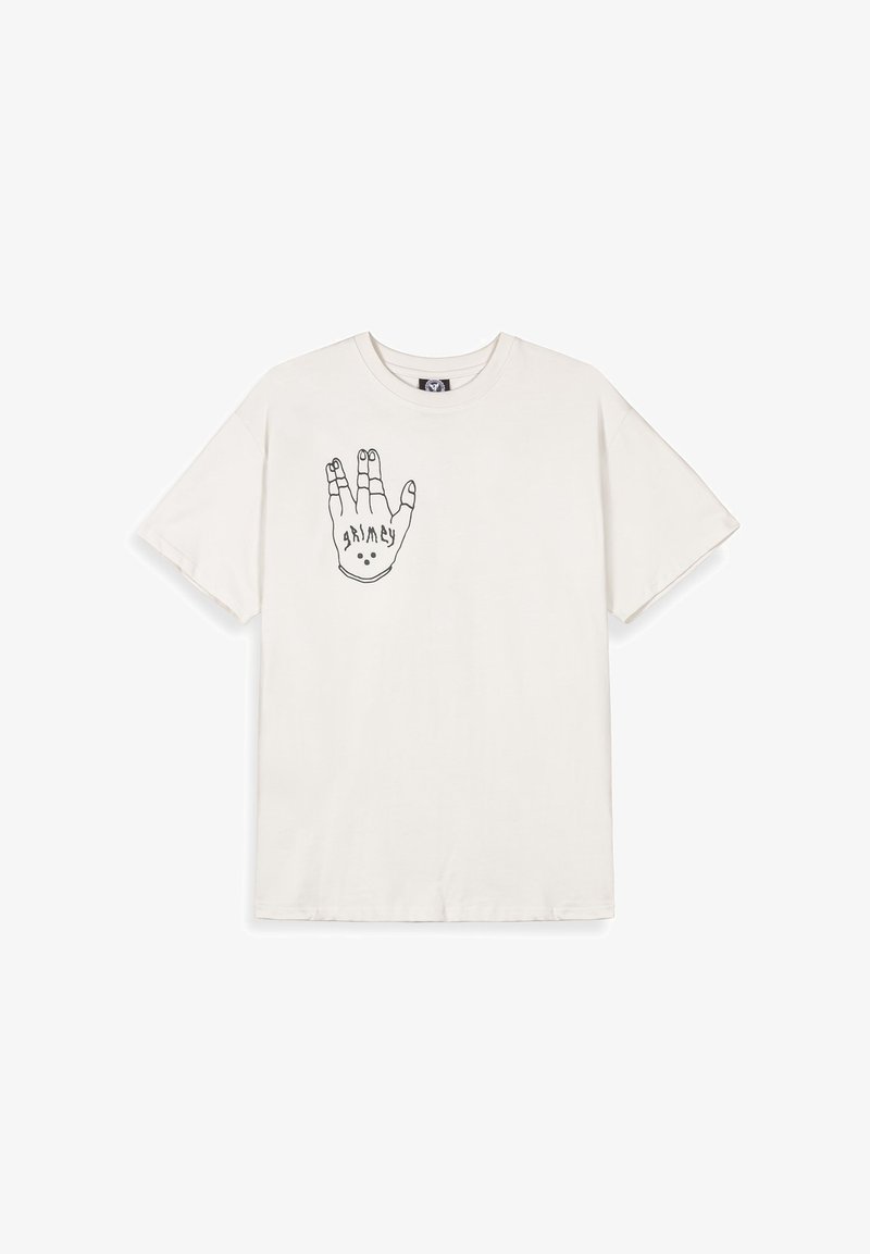 Camiseta de algodón color crema con un gráfico de contorno negro de una mano con elementos de diseño. Mangas cortas y estilo de cuello redondo.