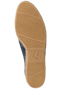Semelle d'une chaussure décontractée avec grip en caoutchouc texturé, taille 5 marquée et logo "pg" embossé sur matière en latex marron clair.