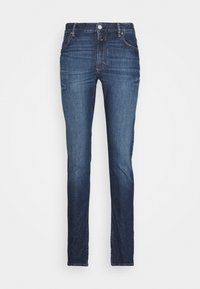 Jeans skinny in denim blu scuro con vita media, cinque tasche e una texture scolorita. Include una chiusura frontale con zip e bottone.