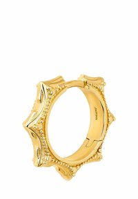 Anillo de metal dorado con forma de estrella, que presenta acentos decorativos texturizados y cuentas elevadas en el borde exterior. Acabado interior suave.
