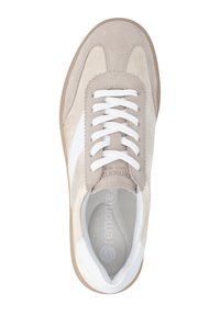 Beige suede sneaker with white leather accents. Features round toe, lace-up front, and rubber sole. Smooth texture with stitched details.