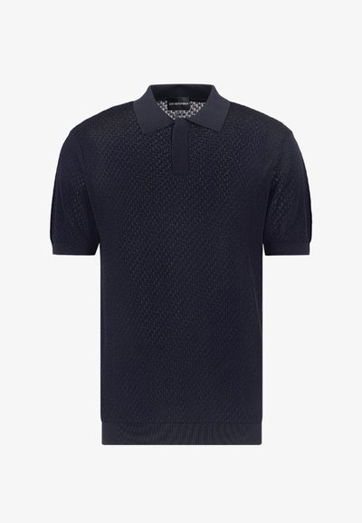 Polo a maniche corte blu navy in tessuto a maglia testurizzata, con colletto classico e orlo a coste. Design semplice, senza motivi o accenti visibili.