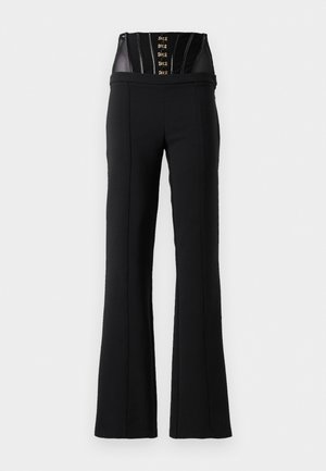 Black high-waist pants with a built-in black corset featuring hook-and-eye closures and vertical seam details.