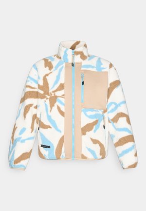 Fleece bunda v krémové barvě s modrými a hnědými abstraktními vzory. Má vysoký límec, kapsy na zip a kontrastní béžové panely.