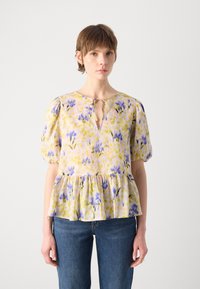 Bluse mit floralem Muster in Gelb, Lila und Pink, mit einem Peplum-Saum, rundem Ausschnitt, puffigen Ärmeln und einem Schlitzdetail vorne.
