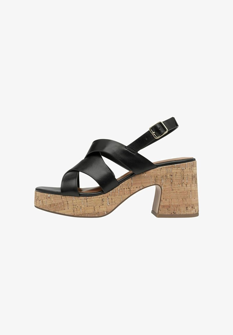 Black leather platform sandals with cross straps, cork block heel, and adjustable ankle strap. Features textured cork surface.