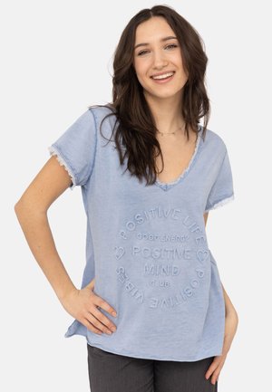 Light blue cotton T-shirt with a V-neck, short sleeves, and frayed edges. Features embossed text including "Positive Life" and hearts.