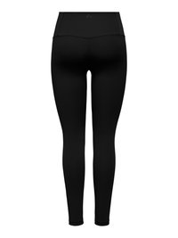 Vista posteriore di leggings neri a vita alta a tutta lunghezza con cuciture piatte e un piccolo logo riflettente sulla fascia in vita.