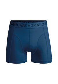 Sötétkék boxer alsó, sima anyagból készült. Fekete elasztikus derékpánttal rendelkezik, amelyen a 'MUCHACHO MALO' márkaneve található, és formálási varratokkal van ellátva.