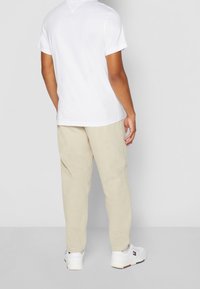 Tommy Jeans T-shirt - bas - white