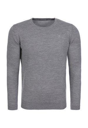 Šedý svetr z měkké látky, má kulatý výstřih, dlouhé rukávy a úzký střih s jemným logem na hrudi.