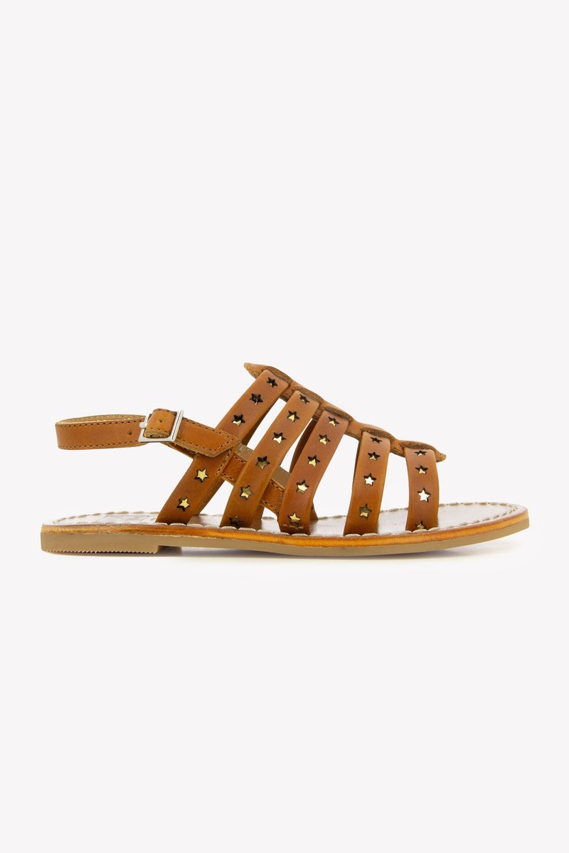 Brown leather sandals featuring multiple straps with star-shaped cutouts, a buckled ankle strap, and a flat sole.
