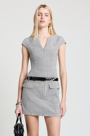 Gray plaid dress with short sleeves, V-neckline, and front zipper. Features a black belt with a decorative chain. Smooth texture, tailored fit.
