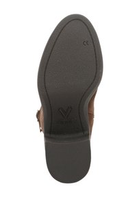 Bruine suède laars met een gestructureerde rubberen zool. Beschikt over een ronde neus en een subtiele Vionic-logo op de zool. Ontworpen voor comfort en ondersteuning.