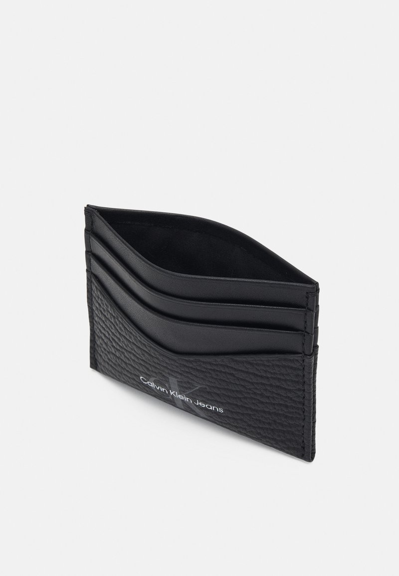 Herren Geldbörsen | Calvin Klein Jeans MONO TEXTURED CARDCASE UNISEX Geldbörse black/schwarz - OV09023 Herren Geldbörsen | Calvin Klein Jeans MONO TEXTURED CARDCASE UNISEX Geldbörse black/schwarz - OV09023