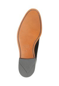 Leren schoenen met een leren zool en een effen tan kleur. Kenmerkt zich door een afgeronde neus, een contrasterende grijze rubberen hak en verdiept logo-details.