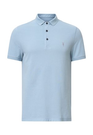 Polo di colore azzurro chiaro realizzato in cotone testurizzato. Presenta un colletto classico, una pattina con tre bottoni e un piccolo logo ricamato sul petto.