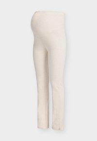 Εγκυμοσυνηκά κολάν σε κρεμ χρώμα, κατασκευασμένα από μαλακό, ελαστικό πλεκτό ύφασμα, με φαρδιά ζώνη μέσης για άνεση και εφαρμοστή σχεδίαση στα πόδια.