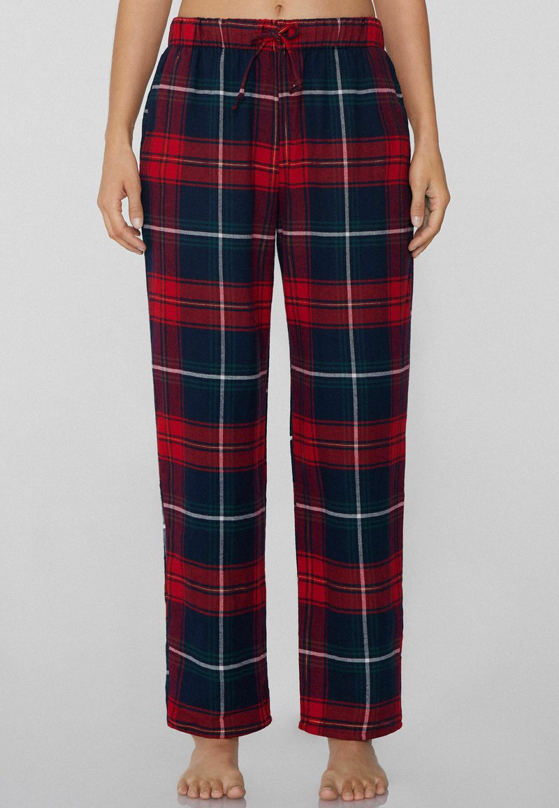 Rode en marineblauwe geruite pyjamabroek met een elastische tailleband en trekkoord. Glad stof met een ontspannen rechte pijp.